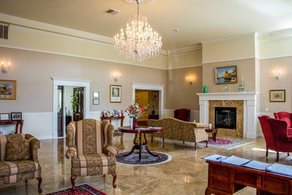 The main lobby with fireplace, chandelier and seating