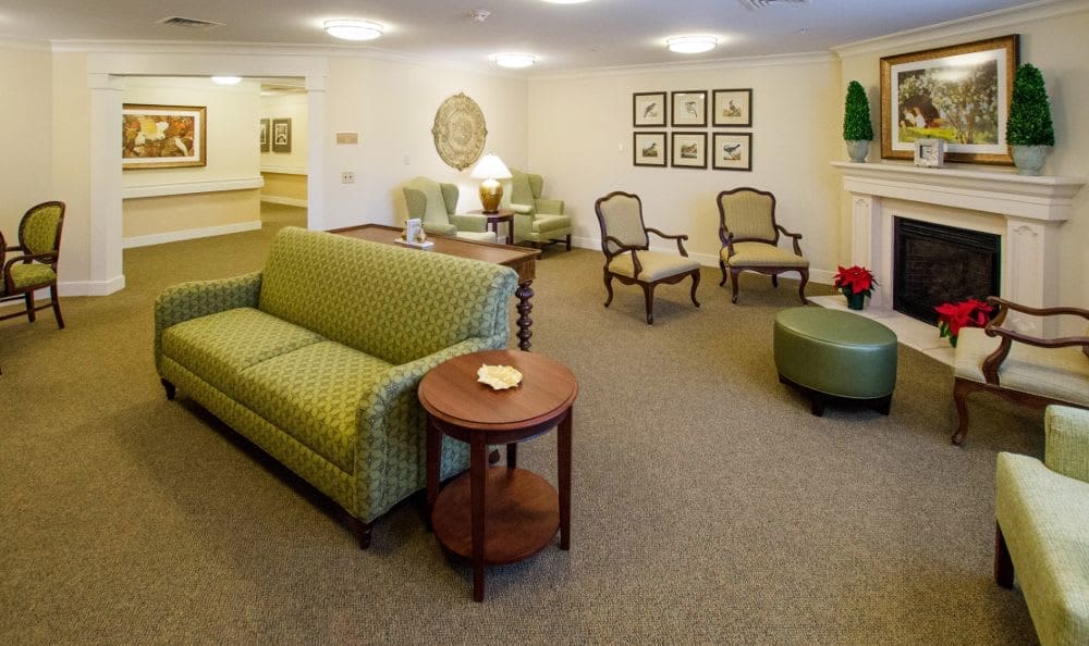 a room with a couch and chairs